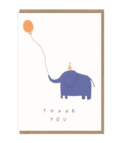 White card with a brown kraft envelope tucked inside. Illustration of a blue elephant wearing a party hat and holding an orange balloon on a string with it's trunk. Underneath in black capital letters, card reads 'thank you'. 