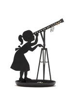 Load image into Gallery viewer, Jewellery stand with shadow of a girl in a dress with a ponytail looking through a telescope. This shadow art sits in a round tray. The telescope features 14 holes for earrings. 
