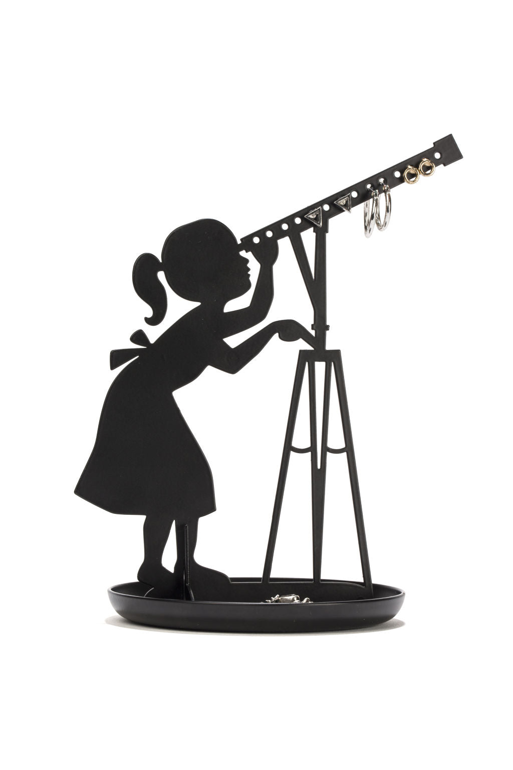 Jewellery stand with shadow of a girl in a dress with a ponytail looking through a telescope. This shadow art sits in a round tray. The telescope features 14 holes for earrings. 