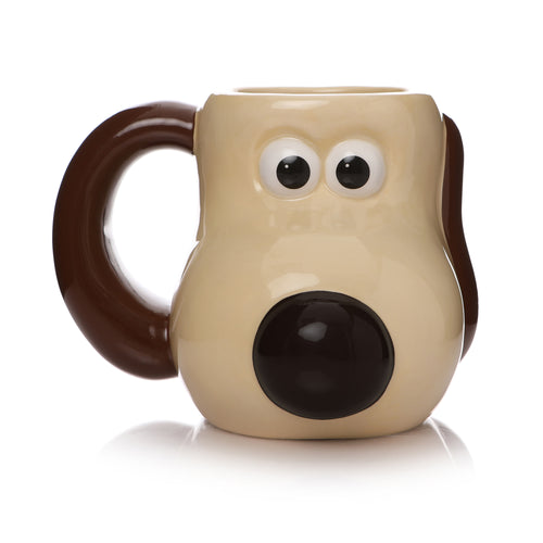 Mug is beige with brown handle. Mug is shaped like Gromit's head with his eyes and nose protruding. One ear is a handle, while the other lies flat against the mug. 