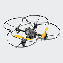 Load image into Gallery viewer, Drone pictured while not flying on white background. 2 of four propellers are white, 2 are yellow. Main frame of drone is black.
