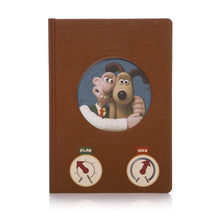 Load image into Gallery viewer, Brown notebook with cut out in middle, illustration of Wallace &amp; Gromit showing through. Underneath are two dials, one titled Plan, ranging from Start to Complete, the other Idea, ranging from weak to strong.
