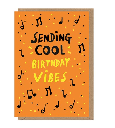 Orange card with 'sending cool' in black capital letters and 'birthday vibes' in yellow capital letters. Around this are music notes and yellow and black dots. A brown kraft envelope is tucked into the card. 