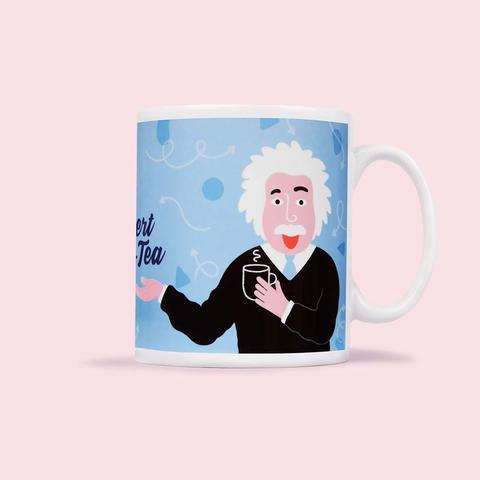 white mug with blue background and Albert 'Eins-tea' (white man with white hair and mustache) holding a mug.