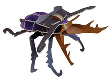 Load image into Gallery viewer, Fully assembled cardboard stag beetle. Colours are purple, black and brown. 
