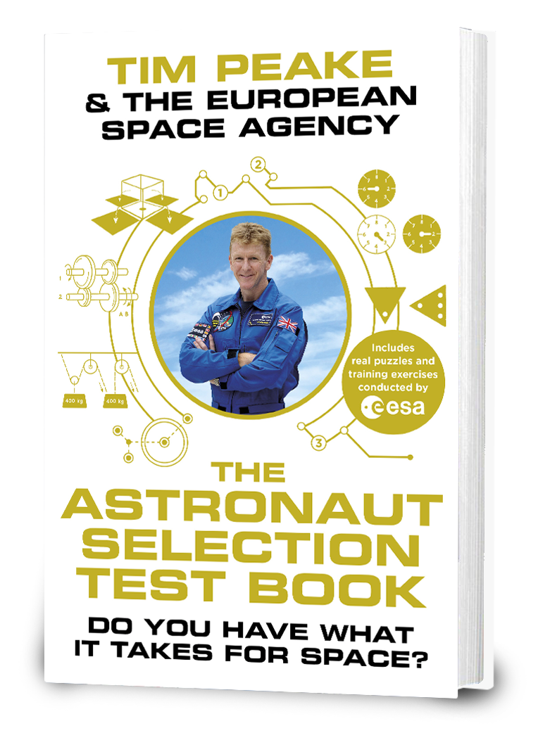 Hardback book seen from an angle to show thickness. Book cover is white with photograph of Tim Peake (a white man) wearing a blue boilersuit with patches. Around this photo are illustrations of puzzles. The book cover reads 'Tim Peake & The European Space Agency, The Astronaut Selection Test Book, Do you have what it takes for space?' A small circle with text reads 'includes real puzzles and training exercises conducted by ESA'.