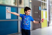 Load image into Gallery viewer, Child playing with a yo-yo. He is wearing a blue shirt with colourful shapes, and a pair of jeans. 
