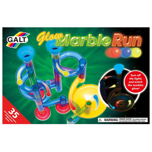 Green box with photo of a plastic marble run. Title reads 'Glow Marble Run', brand name is Galt. Another photo of the marble run in the dark shows glowing funnel and marbles. Red circle with white text reads 'Turn off the lights and watch the marbles glow.' Bottom left corner of packaging reads '35 pieces'. 