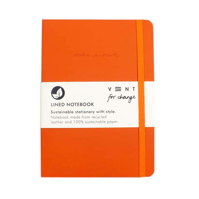 Front of Orange A5 Recycled Leather lined notebook. Removable white paper band around the middle reads: 'Lined Notebook Sustainable Stationery with style. Notebook made from recycled leather and 100% sustainable paper.' An orange elasticated band loops around the front. 'Make a mark' is engraved on the front cover.