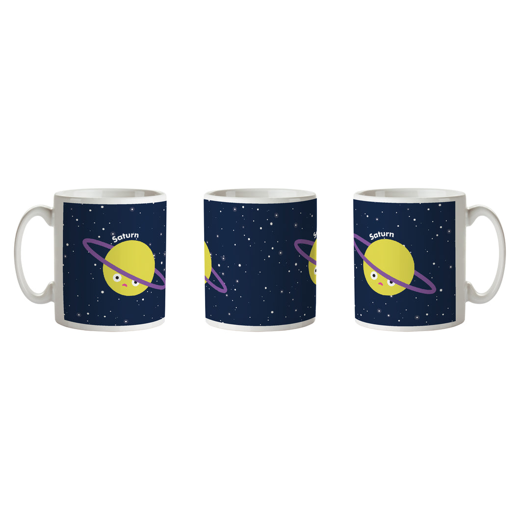 Mug is white with black/blue background, white stars and sad Saturn with 'Saturn' written to the right.