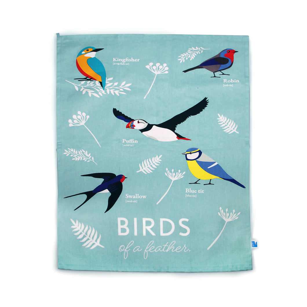 Blue Birds of a Feather tea towel features leaves and 5 birds: Kingfisher, Robin, Puffin, Swallow and Blue Tit. Edit alt text