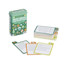 Load image into Gallery viewer, Busy Ideas for Bored Kids Outside Edition is a green tin with colourful illustrations. Cards are stacked next to the tin. 3 examples are pulled from the pile, the titles reading &quot;draw a flower&quot;, &quot;obstacle course&quot;, and &quot;make a leaf collage&quot;.
