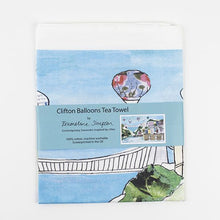 Load image into Gallery viewer, Folded tea towel is inside a paper band. The blue band reads &quot;Clifton Balloons Tea Towel by Emmeline Simpson, contemporary souvenirs inspired by cities, 100% cotton, machine washable. screenprinted in the UK&quot;
