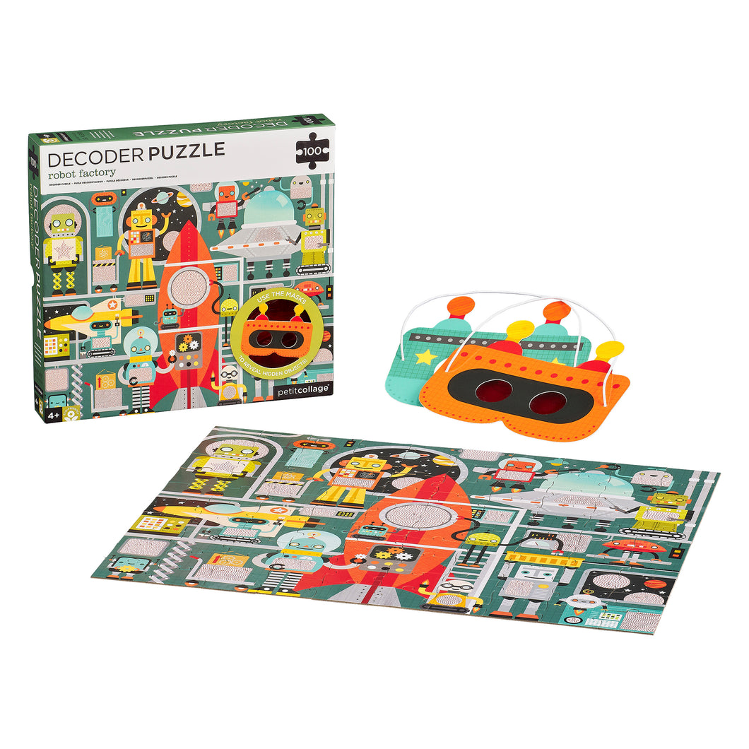 Decoder Puzzle box sits behind and to the left of the completed puzzle. 2 masks sit behind and to the right of the completed puzzle. One mask is orange, black, red and yellow. The other mask is turquoise, yellow, orange and black.