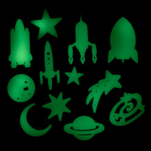 Load image into Gallery viewer, 12 designs shown glowing-in-the-dark have a light green tinge. Designs include 4 space ships, a full moon, a crescent moon, saturn, a galaxy, 4 stars (1 shooting star).

