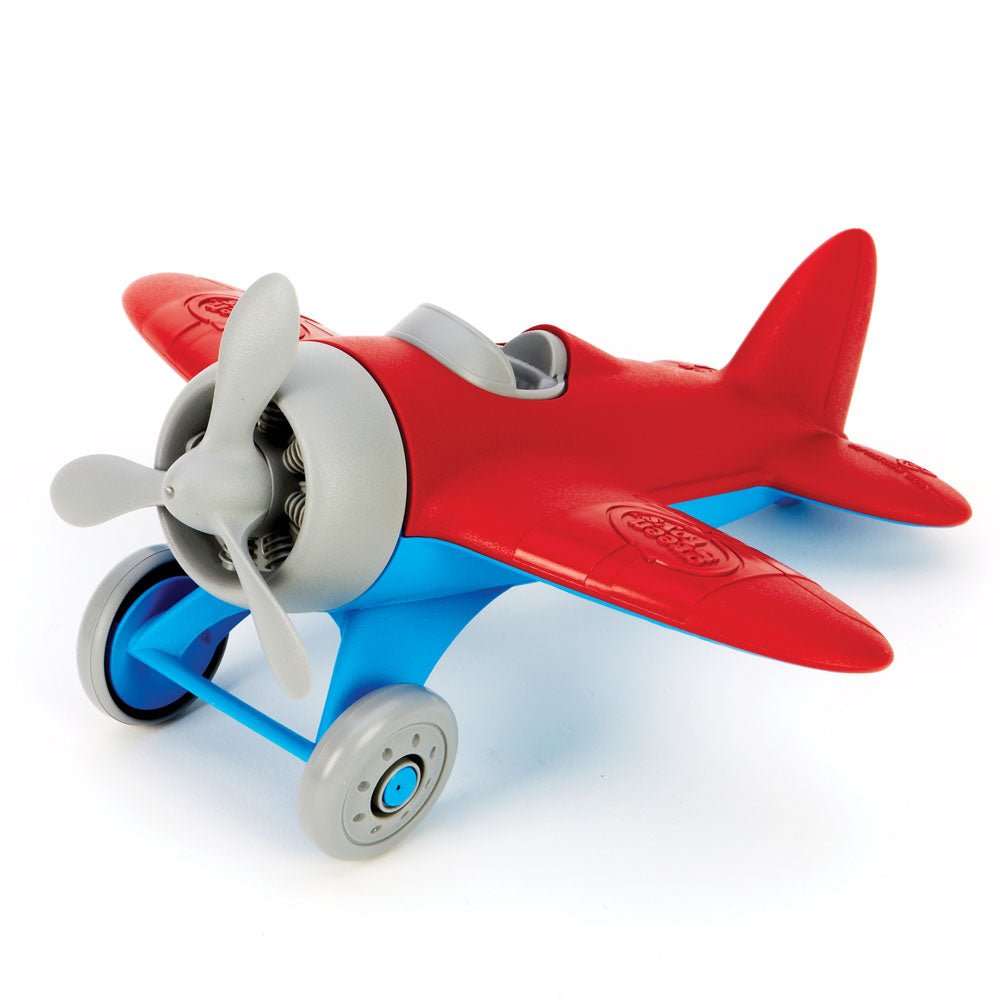 Red airplane with blue undercarriage, grey wheels, propellers & cockpit.
