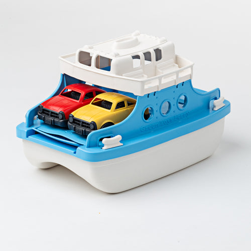 Ferry boat is white and blue. 2 cars sit inside the ferry, one red, one yellow.