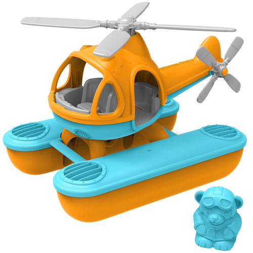 Orange and blue helicopter with 2 sea pontoons attached. A blue bear with an aviator costume is beside the seacopter.