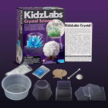 Load image into Gallery viewer, Front of box with contents, including instructions, crystal components, display boxes, mixing pot &amp; stick and cardboard stand.
