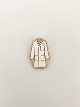 Load image into Gallery viewer, Pin badge is shaped like lab coat. Lab coat is white with pink flowers in the pocket &amp; pink buttons.
