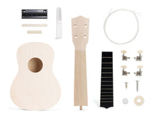 Load image into Gallery viewer, Kit components of a ukulele in a flat lay.
