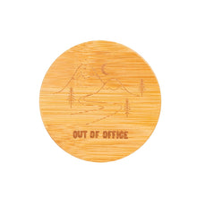 Load image into Gallery viewer, View of the lid from above shows engraved design of two mountains, a moon and a road. Underneath the illustration are the words &quot;OUT OF OFFICE&quot; in all capital letters.
