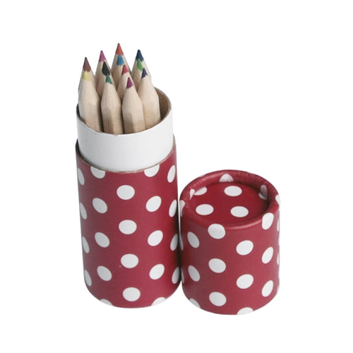 Open cardboard tube with 12 wooden coloured pencils inside. Card tube is red with white polka dots. 