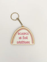 Load image into Gallery viewer, Keyring reads &#39;Science is for everyone&#39;. Shape of keyring is half an oval. Above the words is a rainbow. A small chain leads to a keyring attachment. 
