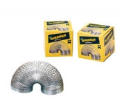 Metal slinky is splayed in an arch. In the background are two small yellow cardboard boxes with pictures of springers on them. 