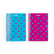 Load image into Gallery viewer, Two notebooks side by side. On the left is a blue notebook with pink pattern. On the right is a pink notebook with blue patterns. At the top of both notebooks is the we the curious logo in white. At the bottom of each notebook is the name &quot;we the curious&quot; in white and upside down. 

