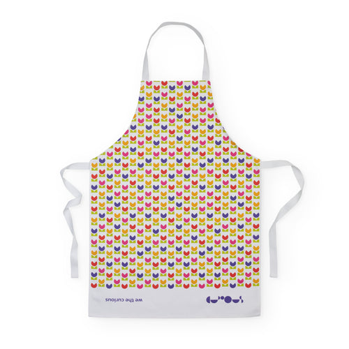 White apron has a pattern of purple, red and yellow flowers with green leaves. Loops and ties are white. At the base a white border shows the name 