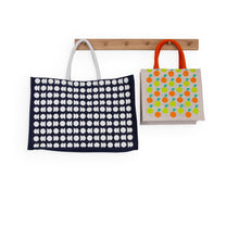 Load image into Gallery viewer, 2 jute bags on a wooden hook. Larger moon phase notebook to the left, smaller mandarin and lime jute bag to the right. 
