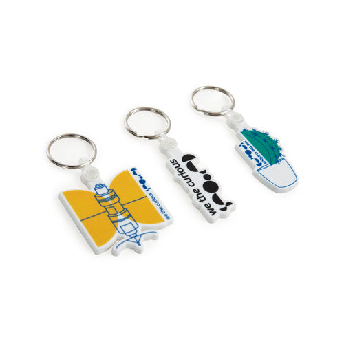 3 keyrings in a line with different designs: satellite, logo and cactus. 