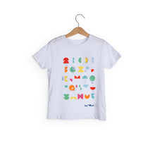 Load image into Gallery viewer, White t-shirt shows different coloured shapes with white lines on top. We The Curious logo is in bottom corner.
