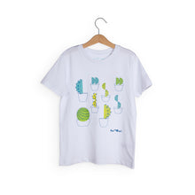 Load image into Gallery viewer, White t-shirt with 8 different cactus designs with different shades of green. We The Curious logo in navy blue is in bottom right. 
