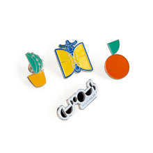 Load image into Gallery viewer, 4 enamel pin badges. Designs include black and white We The Curious logo, blue and yellow satellite, green cactus in yellow pot, and orange mandarin with green leaf.
